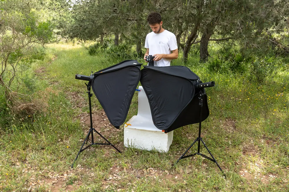 Rayane Vuillemin reviewing photographs after a shoot in a pine forest near Rabat, Morocco
